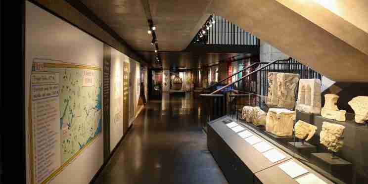 Discovery Centre with medieval stonework and illustrated map